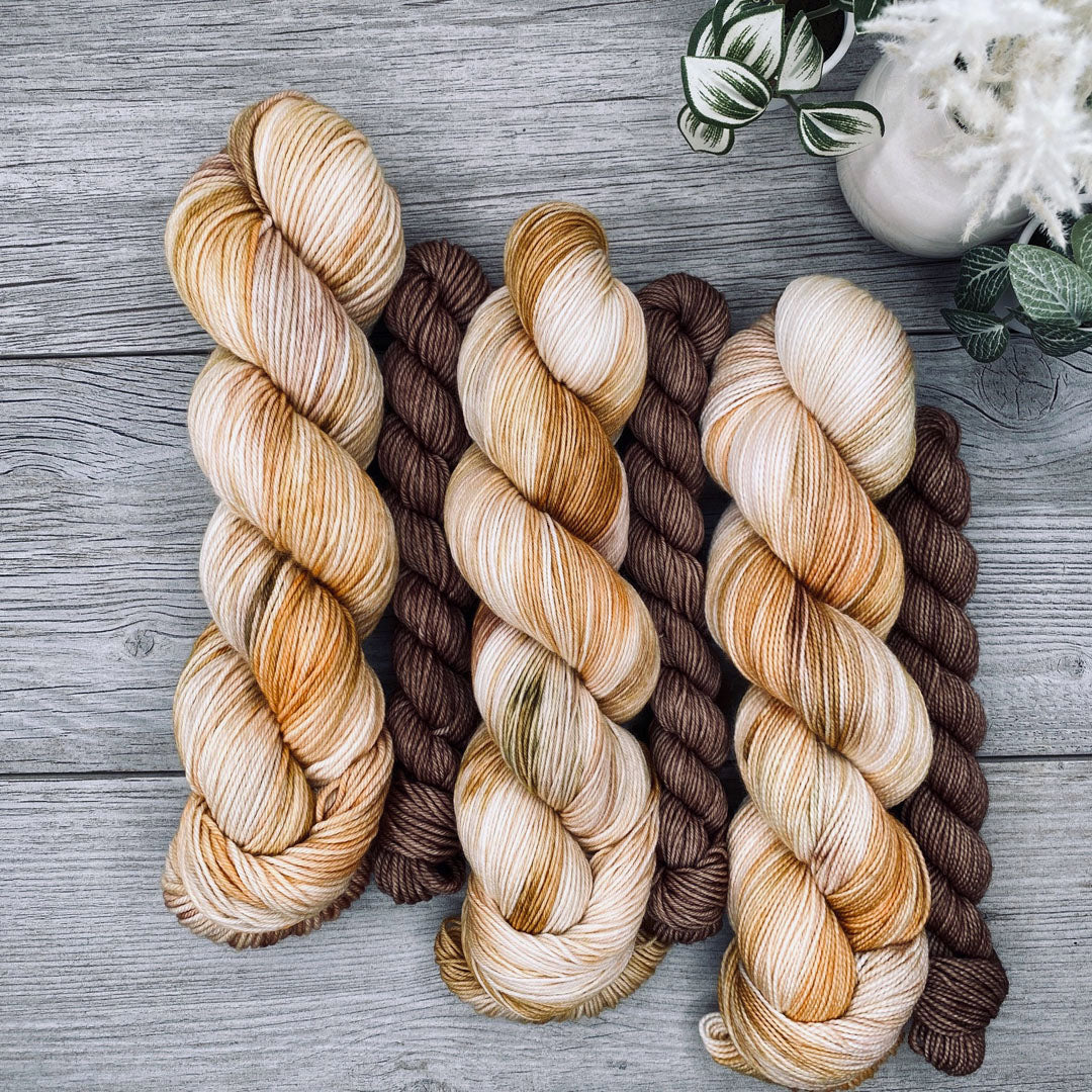 Autumn yellows, greens and brown full skein with a bark brown mini skein.