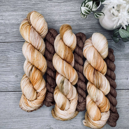 Autumn yellows, greens and brown full skein with a bark brown mini skein.